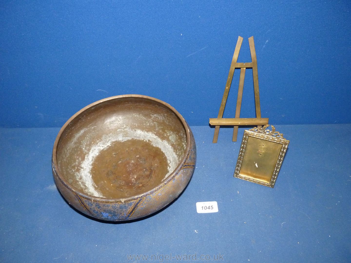 An old possibly Kashmiri bowl with metal lining and the outside decorated with Kashmiri style paper,