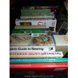 A quantity of gardening and sewing books.