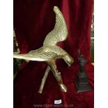 A Brass Eagle and a bronze effect Statue of liberty,