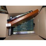 A box of books to include The Enchanted Canopy, National Geographic, Last Wild Places etc.