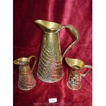 Three brass jugs,