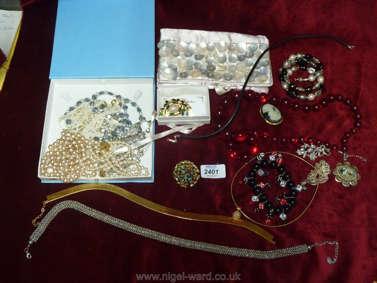 Two boxes of costume jewellery to include a pearl choker, brooches, necklaces, 'Monaco' brooch etc.