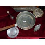 A copper frying pan, small pewter plate, scoop etc.