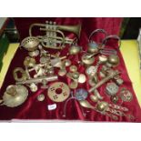 A box of brassware to include trumpet bells, taps, very large key, stirrups etc.