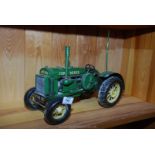 Model of a John Deere tractor.