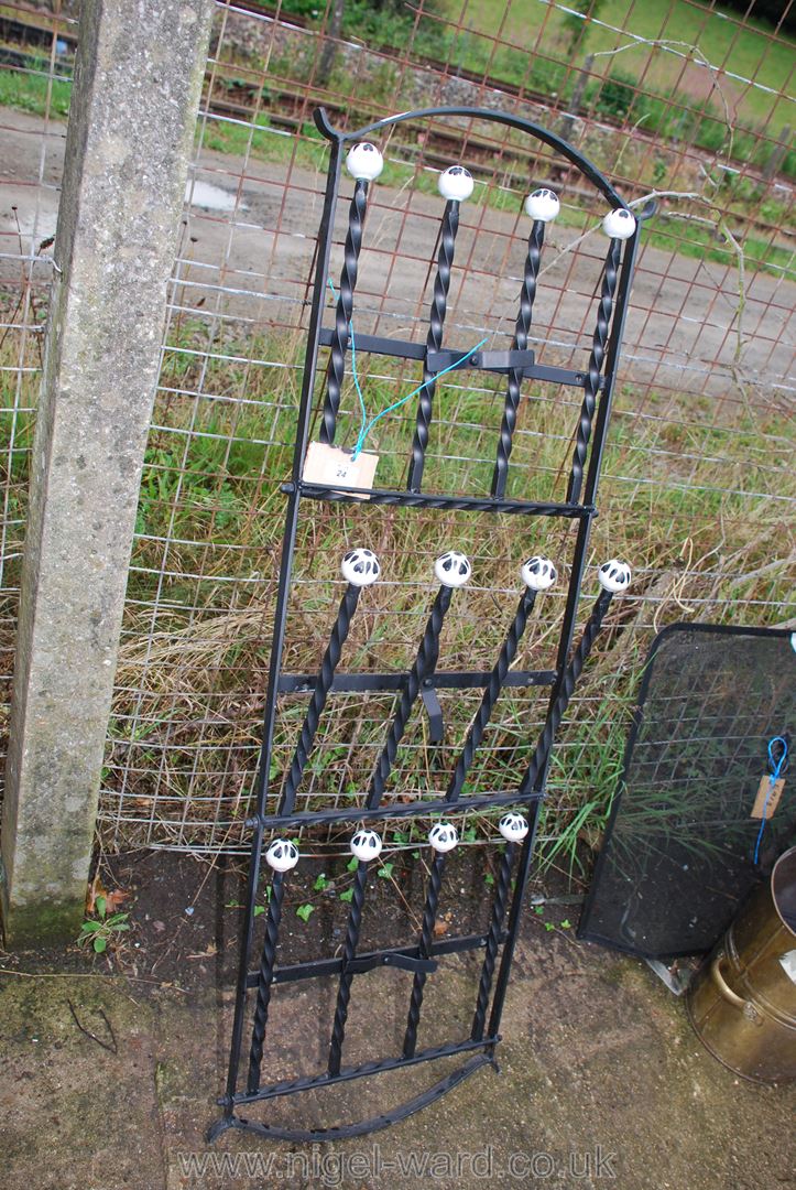 Folding metal rack for six pairs of wellingtons