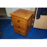 Medium Oak bedside three drawer chest.