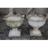 Two concrete garden planters,