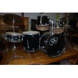 Drum set of five drums and three cymbals.