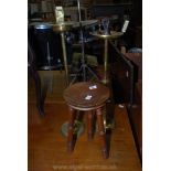 Two brass smokers companions and a wooden stool.