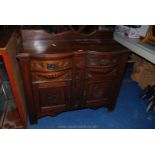 Carved detail sideboard with two drawers over cupboard.