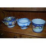 Three pots including blue and white and decorated.