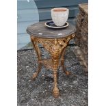 Cast iron pub table on paw and claw feet 20" diameter, plus garden pot etc.