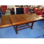 An oak draw leaf Dining Table on square base and legs extending to 84'' x 39'' x 30'' high,