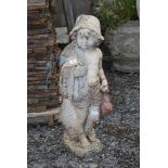 Concrete statue of young fisher boy,