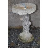 Concrete bird bath on tree trunk effect pedestal