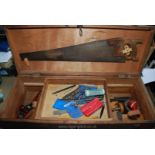 Carpenters tool box containing various saws, planes, mallets, drills etc.