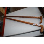 2 x wooden walking sticks, one carved,