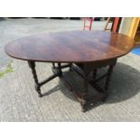 Drop leaf oval Oak Dining table on barley twist legs, open 67'' x 48'' x 30'' ,