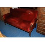 Edwardian buttonback red upholstered sofa, Mahogany framed with turned and reeded legs,