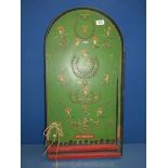 A 1940/50's pin football Bagatelle board with unusual silhouette images of spectators to the base.