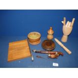 A quantity of Treen including an artist's hand, Dutch pot, pipe, guillotine, Mauchlineware pin case,