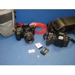 A small quantity of cameras including Canon E0S 1000 FN SLR camera with a Canon Zoom lens EF 35 -80