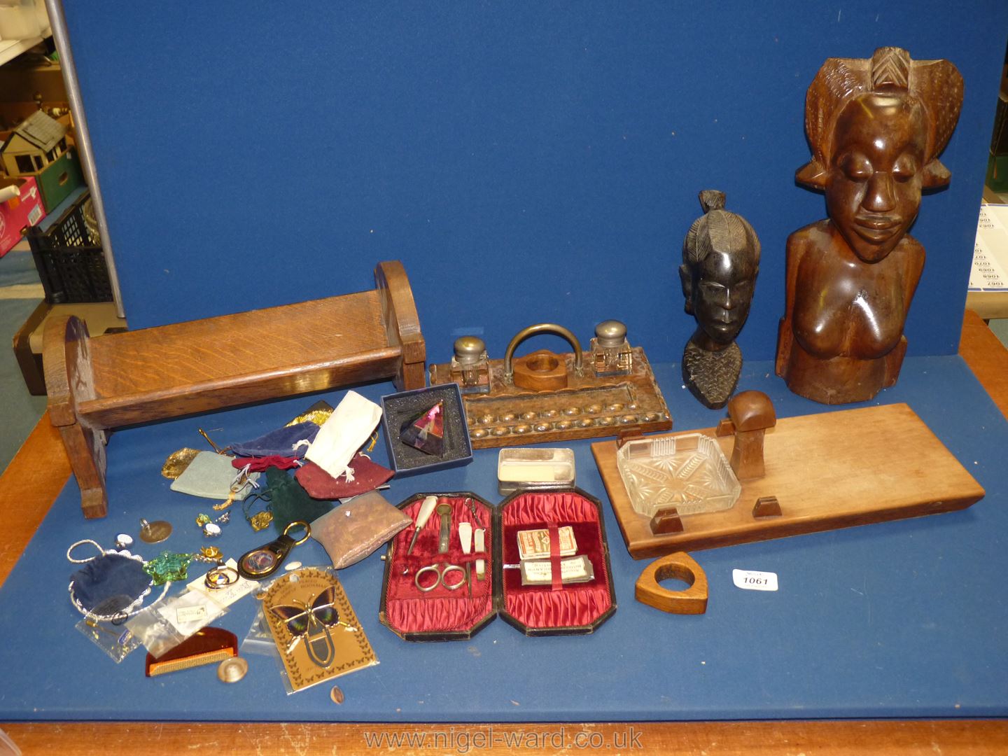 A quantity of miscellanea and Treen including book trough, desk stands, carved ethnic head,