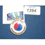 An American 50th anniversary medal commemorating the Korean War.
