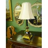 A square based brass and black metal table lamp, 25" tall including shade.