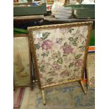 A gilt framed metamorphic firescreen with fabric under glass panel, converts into a small table.