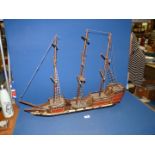 A vintage replica wooden Galleon "Santa Fe", rigging in need of attention,