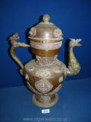 A Tibetan copper and brass ceremonial Dragon ewer with dragon handles and spout,