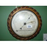 A rope twist design wooden frame barometer/thermometer,