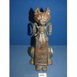 A cast novelty cat Doorstop in the form of a cat supporting a placard with early Scottish motto