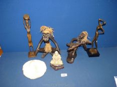 A quantity of carved figures including; tribal, female and soapstone plus a piece of coral.