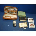 A quantity of miscellanea including white metal cigarette cases, boxed lady's vintage compact,