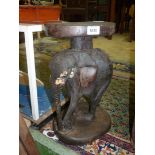 A carved wooden African elephant stool/plant stand, 16'' tall.