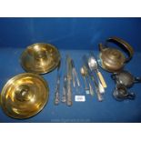 A quantity of metalware to include cutlery, spoons, plated jugs, knives, brass candleholders,