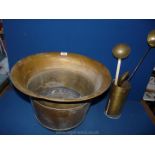 A large flared brass jardiniere, long handled spoons etc.