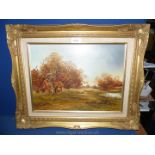 A gilt framed Oil on board depicting a barn in the trees with sheep,