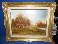 A gilt framed Oil on board depicting a barn in the trees with sheep,