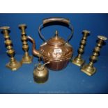 A copper kettle, a sprayer and four brass candlesticks.