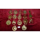 A quantity of horse brasses including; parrot, bell, clover, etc.