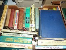 A box of books to include; In a Wiltshire Village, Staffordshire Portrait figures, etc.