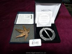 A Pewter scarf ring by Lady Crow Silks and a maple leaf shaped brooch by Leaves of Gold.