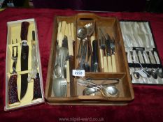 A tray of cutlery, a cased set of EPNS teaspoons and a boxed Sheffield stainless steel carving set.