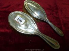 Two silver backed hair brushes; both hallmarked Birmingham, maker DM Co.