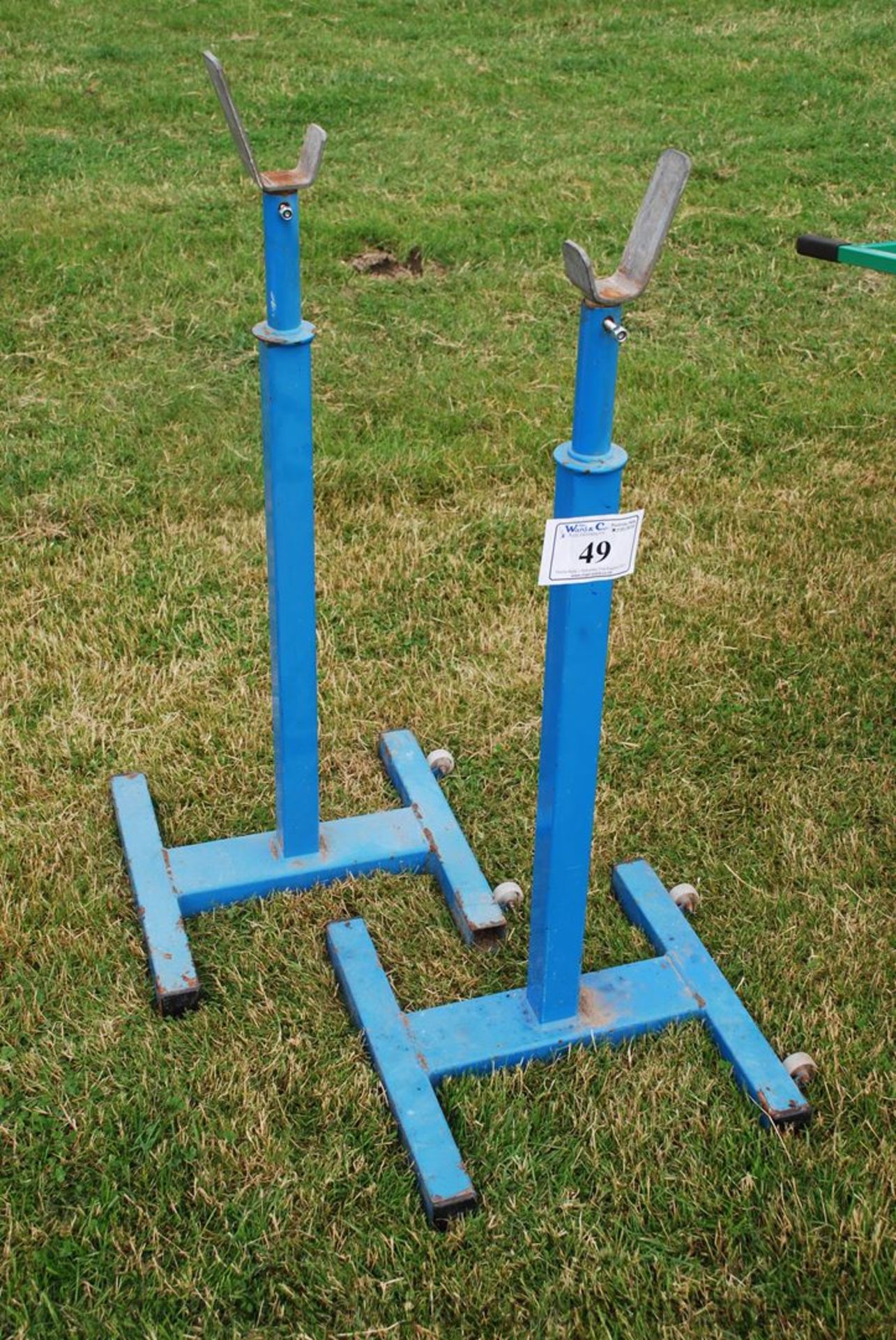 Blue reel stands, adjustable for height.