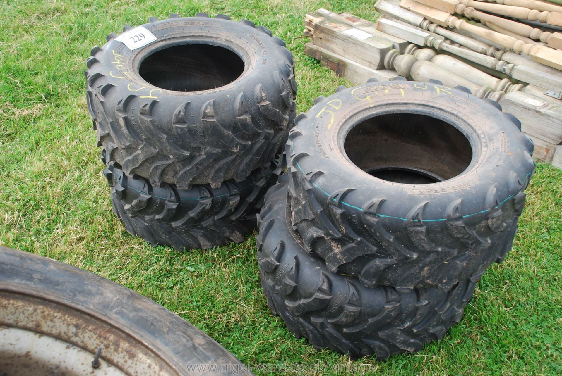 Four John Deere gator Mud Gear tyres, 2 being 25 x 11-12 and two 25 x 10-12.